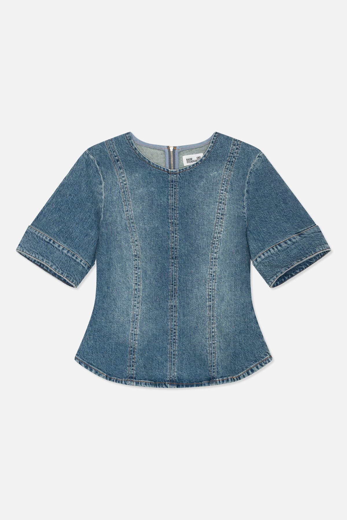 Back view of a blue denim top with short wide sleeves, a round neckline, vertical panel seams and a short centre-back zip.